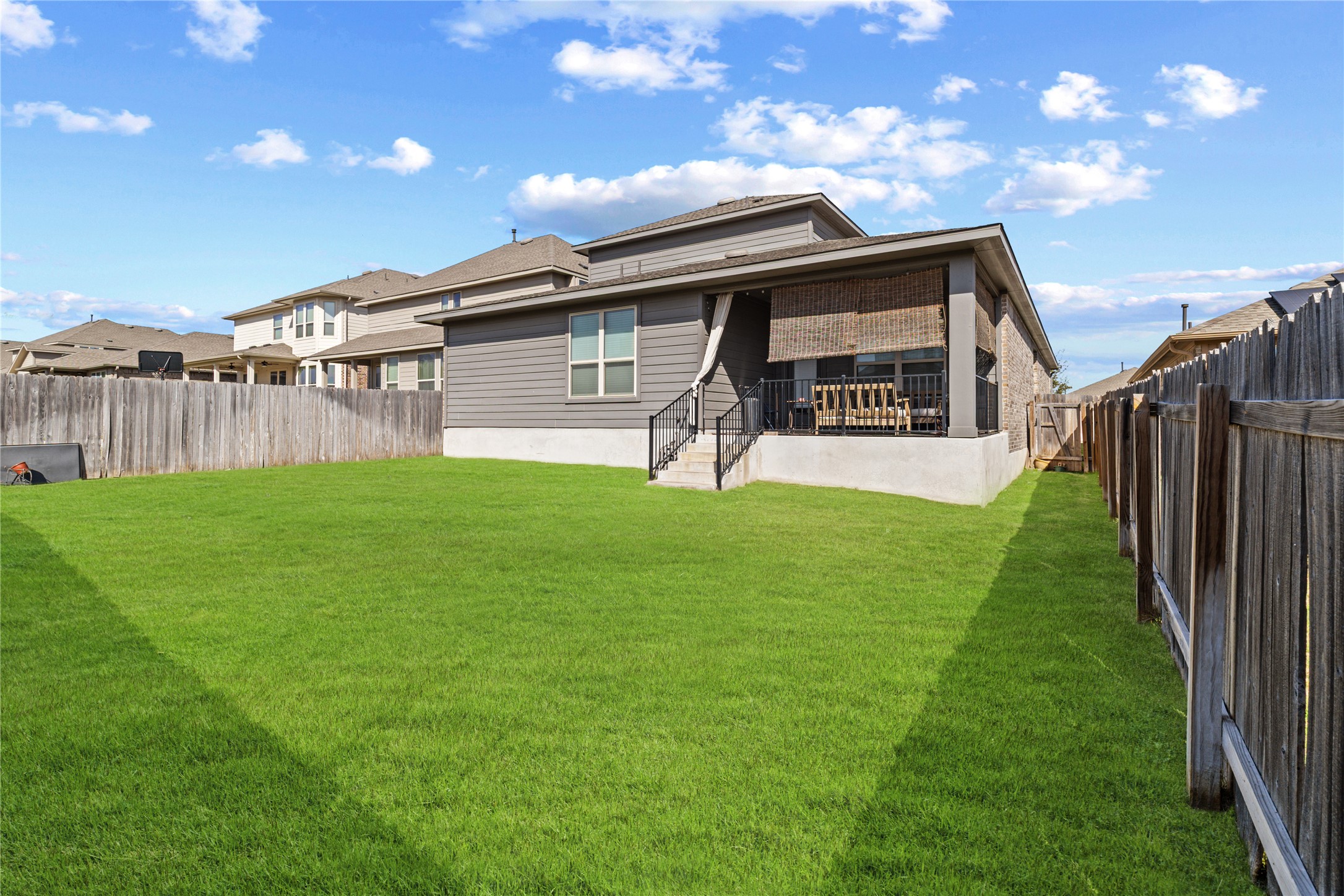 276 Finstown Street Hutto, TX 78634 - Photo 15 of 19 a view of a yard in front of a house with a yard