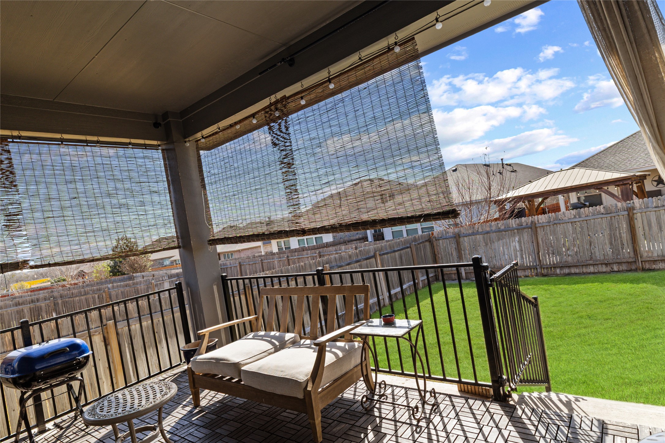 276 Finstown Street Hutto, TX 78634 - Photo 17 of 19 a balcony with table and chairs