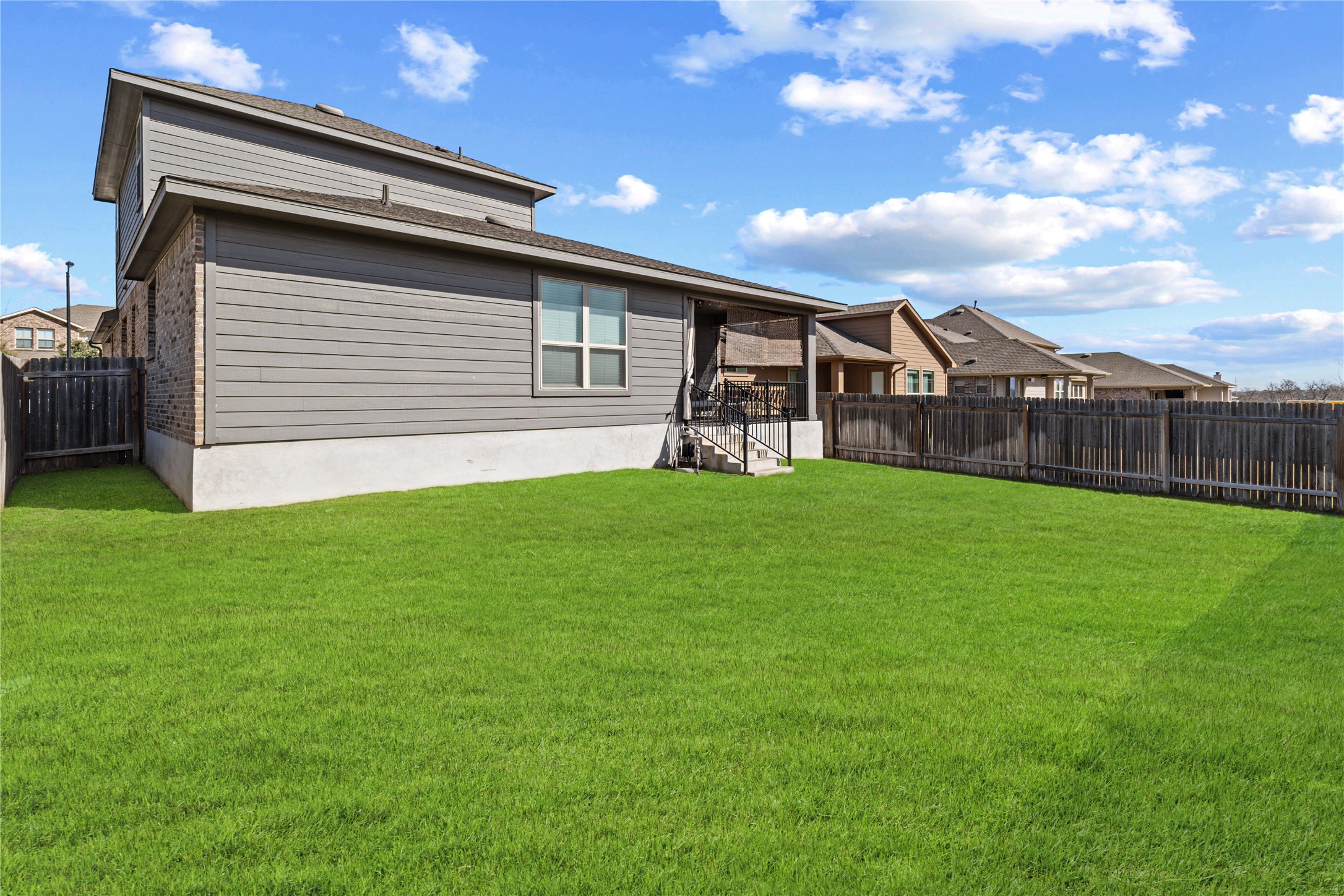 276 Finstown Street Hutto, TX 78634 - Photo 18 of 19 a view of a backyard with a garden