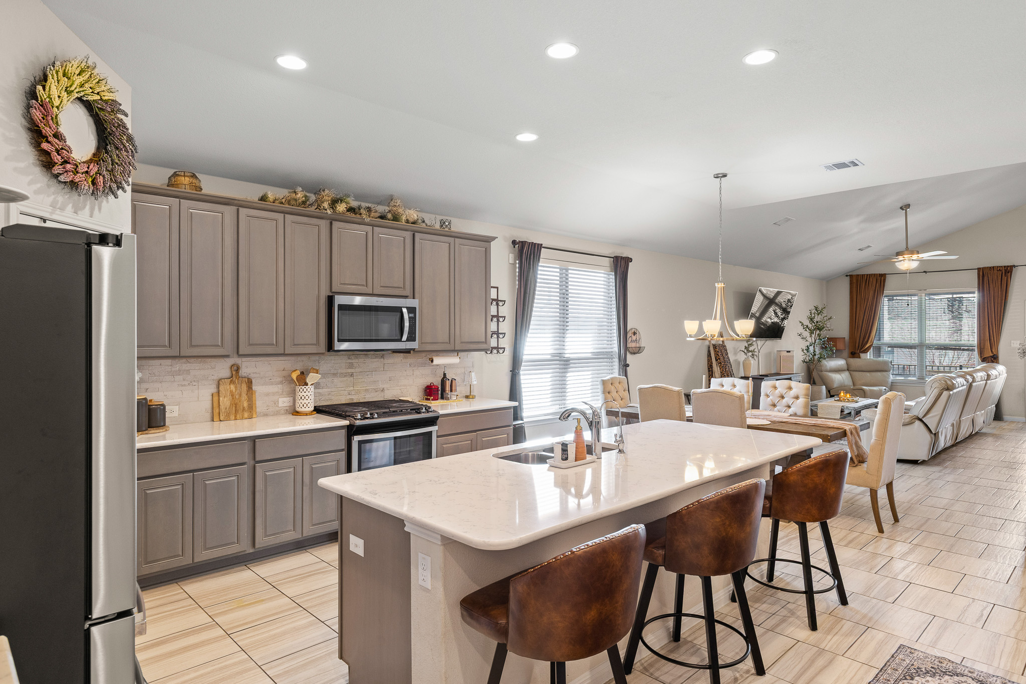 276 Finstown Street Hutto, TX 78634 - Photo 6 of 19 a kitchen with appliances a sink and cabinets