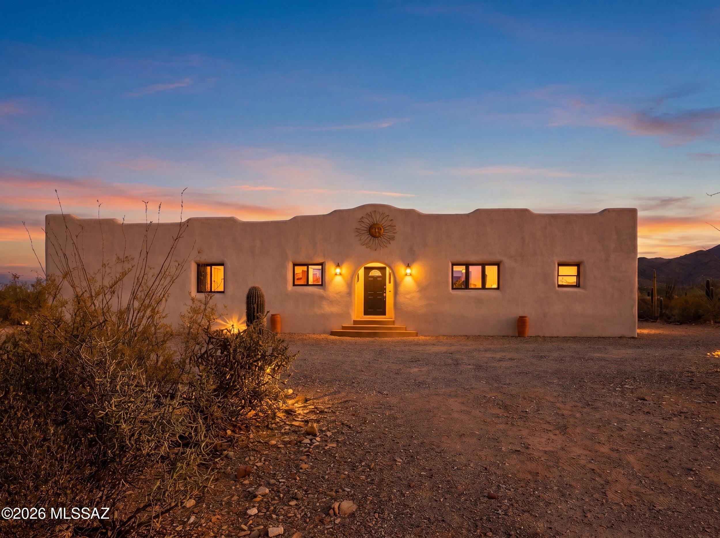 10855 West Mile Wide Road Tucson, AZ 85743 - Photo 1 of 47 Front of Home Sunset