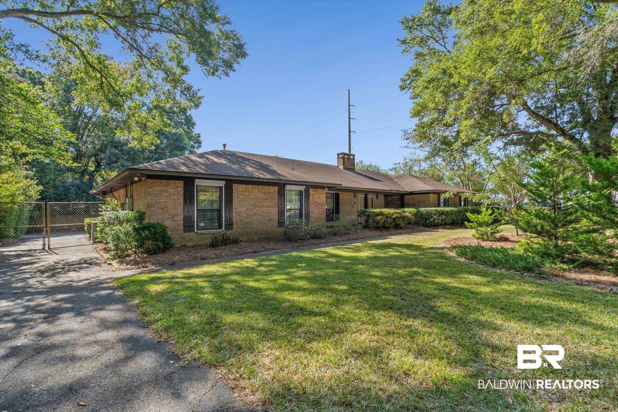 1900 Foxfire Road Mobile, AL 36618 - Photo 32 of 36 Ranch-style house featuring brick siding and a chimney