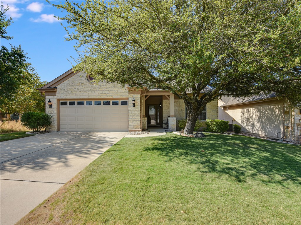 334 Fieldstone Drive Georgetown, TX 78633 - Photo 1 of 1 a front view of a house with a yard and garage