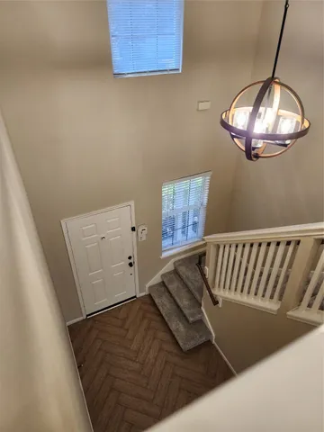 a view of hallway with windows