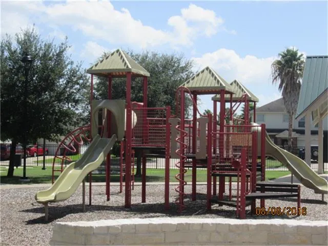 a front view of a house with a garden and plants