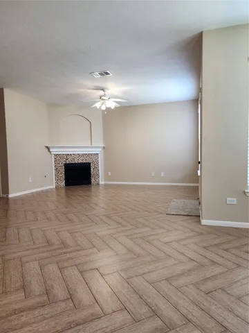 an empty room with a fireplace