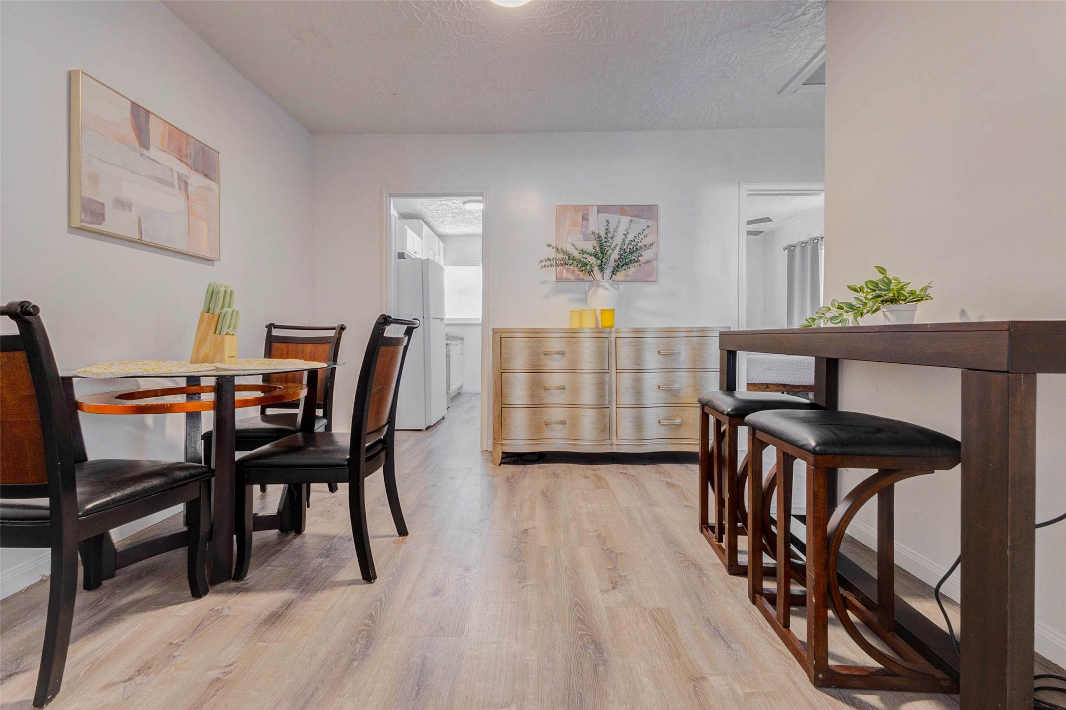 2902 Truxillo Street Houston, TX 77004 - Photo 12 of 32 a view of a dining room with furniture and wooden floor