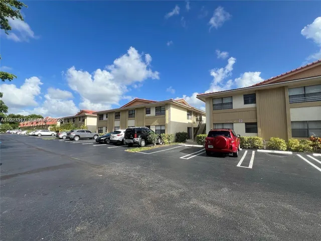 a view of a car is parked in front of the house