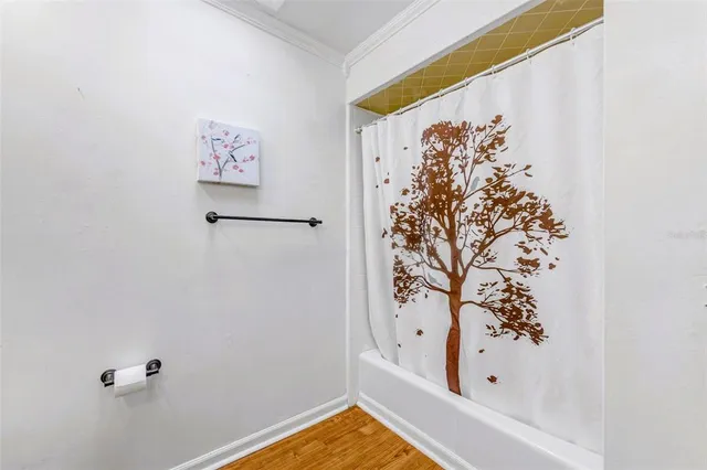 a bathroom with a bathtub and shower