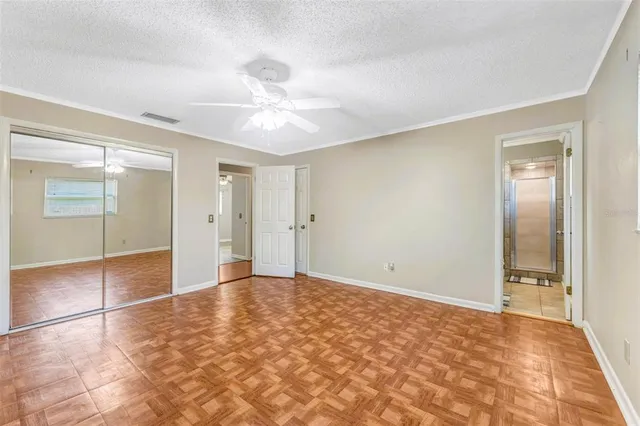 a view of an empty room with a bathroom