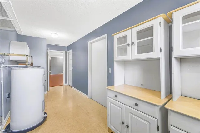 a kitchen with a stove and a refrigerator