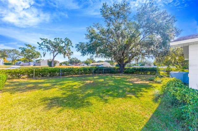 a view of swimming pool is middle in the garden