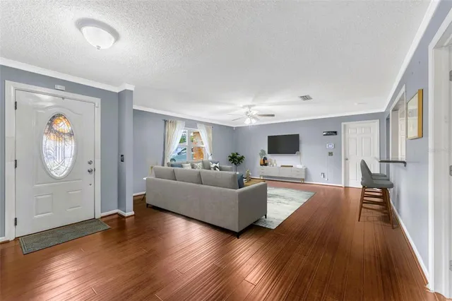 a living room with fireplace furniture and a flat screen tv