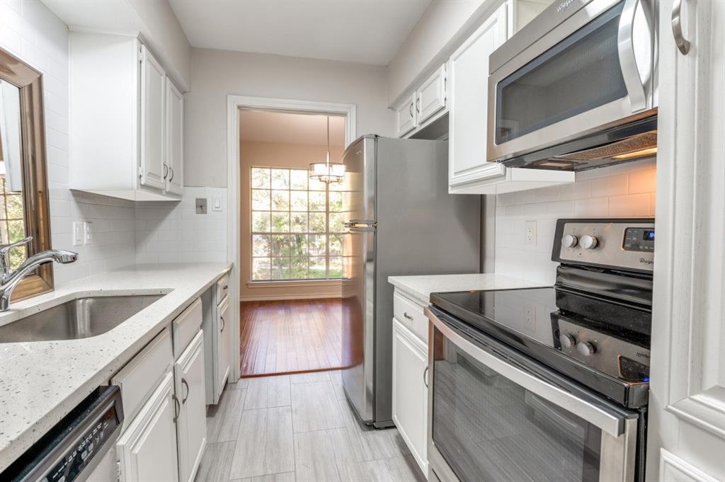 6315 Campbell Road, Unit 510 Dallas, TX 75248 - Photo 4 of 11 a kitchen that has a sink and a stove