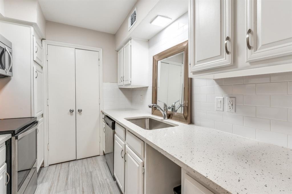 6315 Campbell Road, Unit 510 Dallas, TX 75248 - Photo 5 of 11 a kitchen with a sink and cabinets