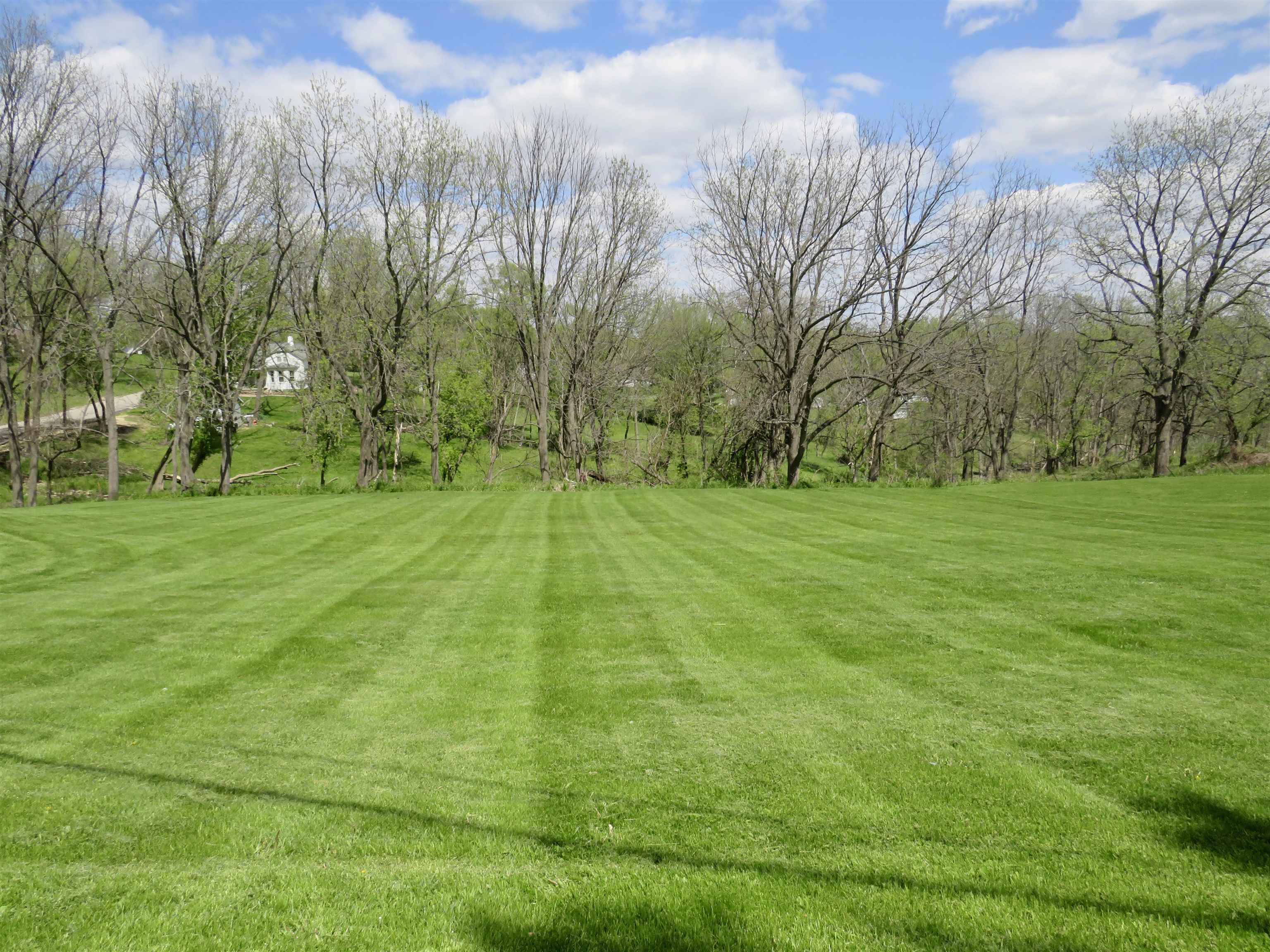 Tbd Fulton Street Galena, IL 61036 - Photo 1 of 4 a backyard of apartments with large trees