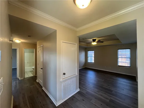 a view of gallery with wooden floor
