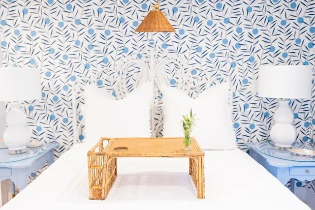 a bedroom with a bed and a table