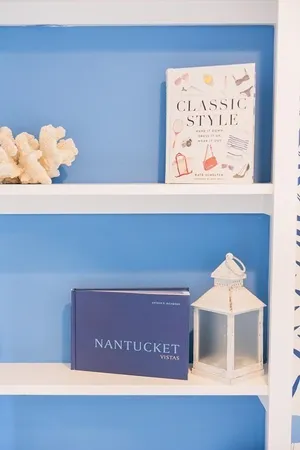 a view of a bedroom with a bed and wooden floor