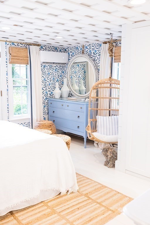 7 Bank Street Nantucket, MA 02554 - Photo 17 of 34 a view of a bedroom with a bed and wooden floor