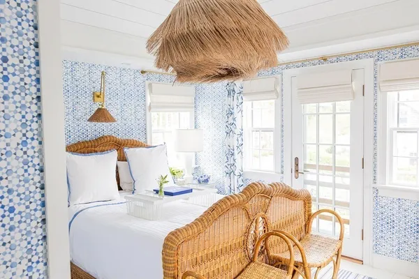 a dining room with furniture a potted plant and a window
