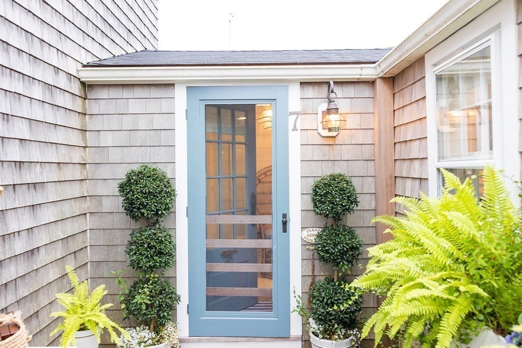 7 Bank Street Nantucket, MA 02554 - Photo 25 of 34 a front view of a house with a yard