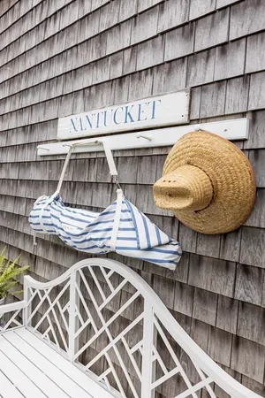 a view of a patio with table and chairs and potted plants