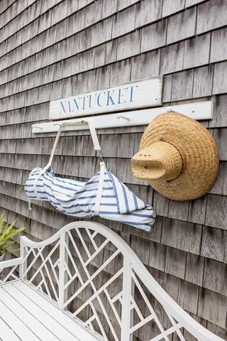 a view of a patio with table and chairs and potted plants