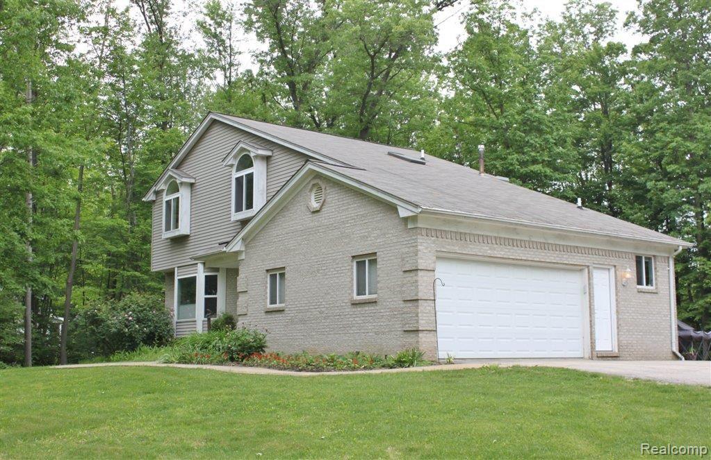 4411 Granger Road Ortonville, MI 48462 - Photo 2 of 25 Neslted on 2.5 Private acres