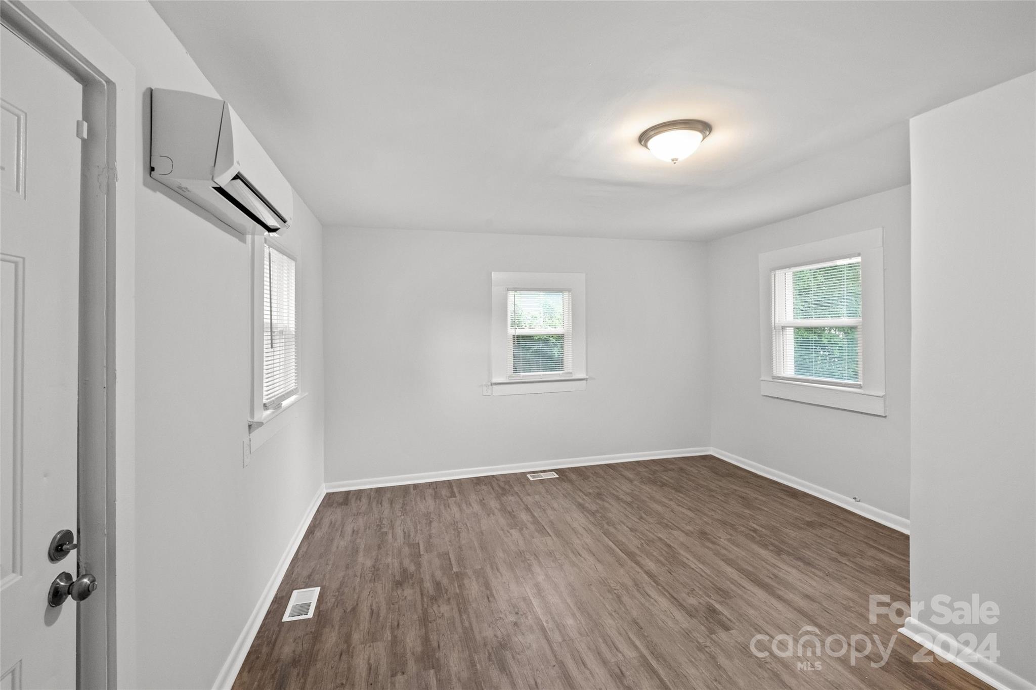 3106 Tuckaseegee Road Charlotte, NC 28208 - Photo 23 of 44 a view of a room with wooden floor and windows