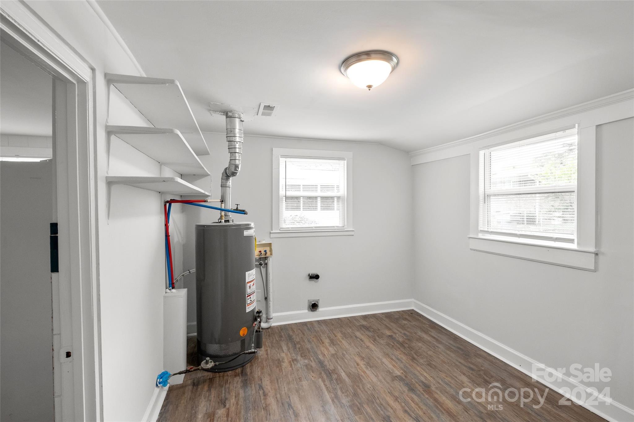 3106 Tuckaseegee Road Charlotte, NC 28208 - Photo 26 of 44 a view of empty room with wooden floor and fan