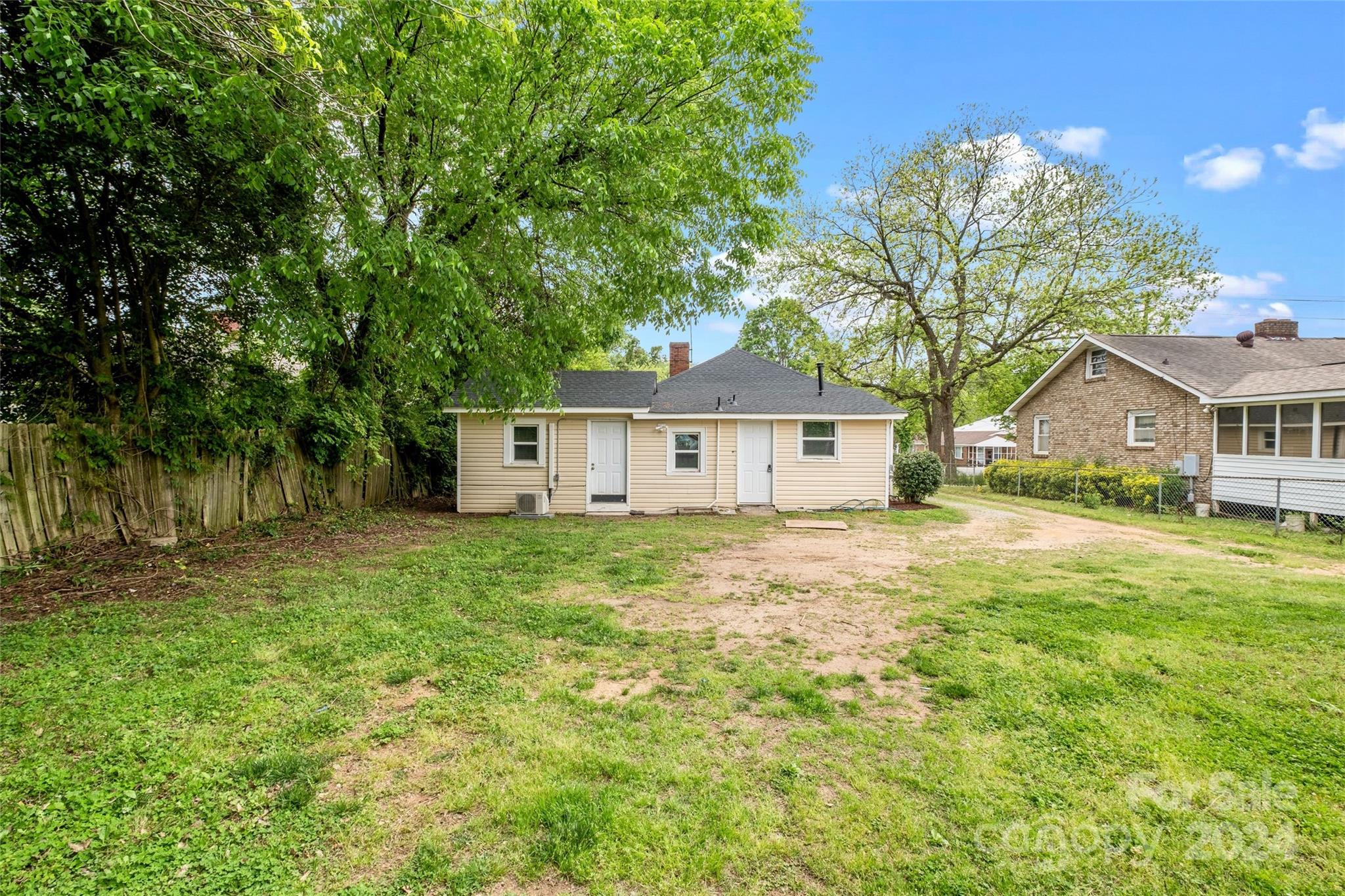 3106 Tuckaseegee Road Charlotte, NC 28208 - Photo 27 of 44 a view of a house with a yard