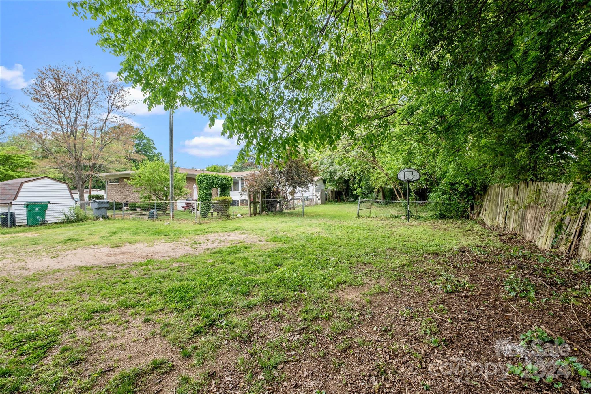 3106 Tuckaseegee Road Charlotte, NC 28208 - Photo 29 of 44 a view of a house with a big yard