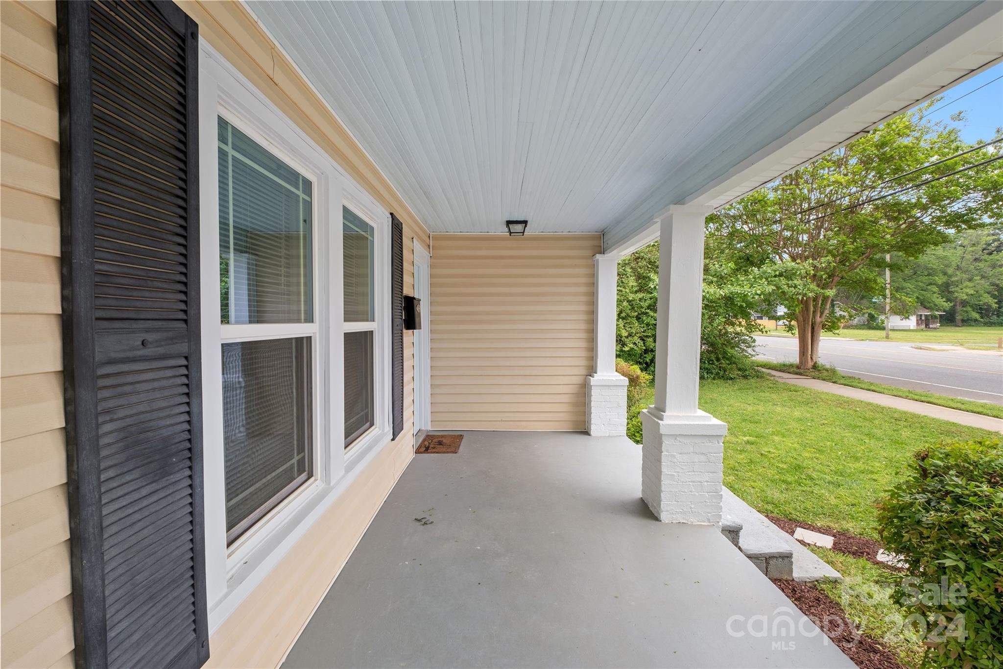 3106 Tuckaseegee Road Charlotte, NC 28208 - Photo 3 of 44 a view of a porch with wooden floor and fence