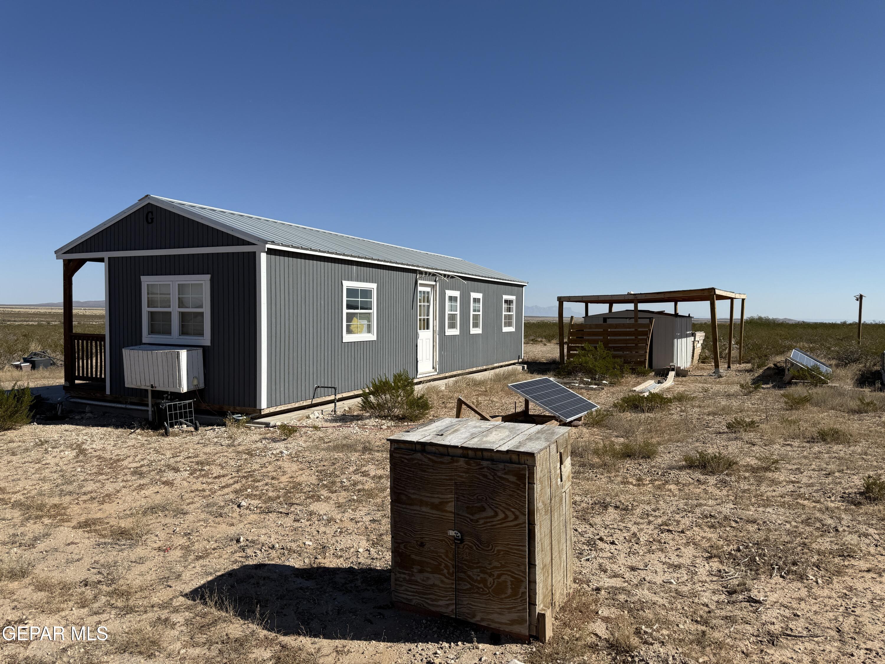 26 Ponderosa Road Salt Flat, TX 79847 - Photo 15 of 56 a front view of a house with yard