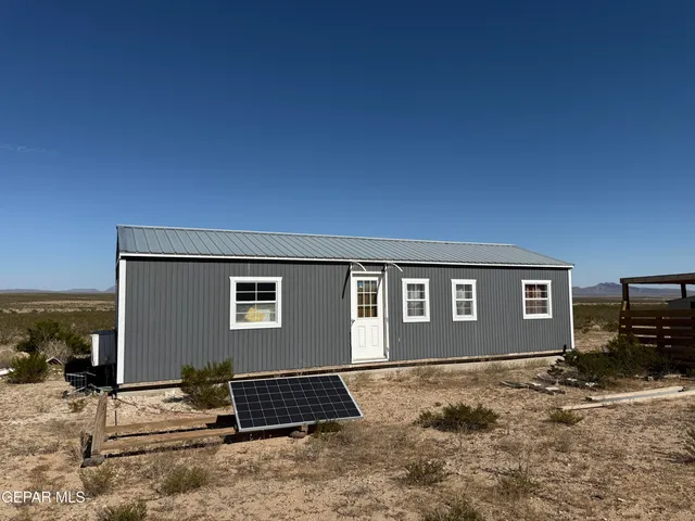 a bedroom with a bed and a mirror