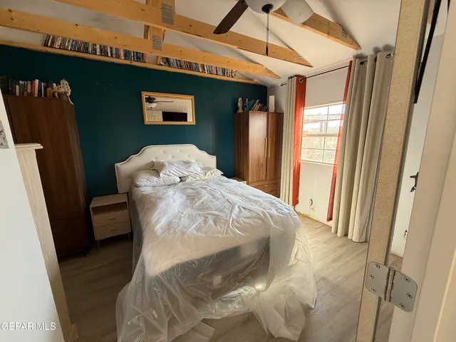 a view of a patio with table and chairs and wooden floor