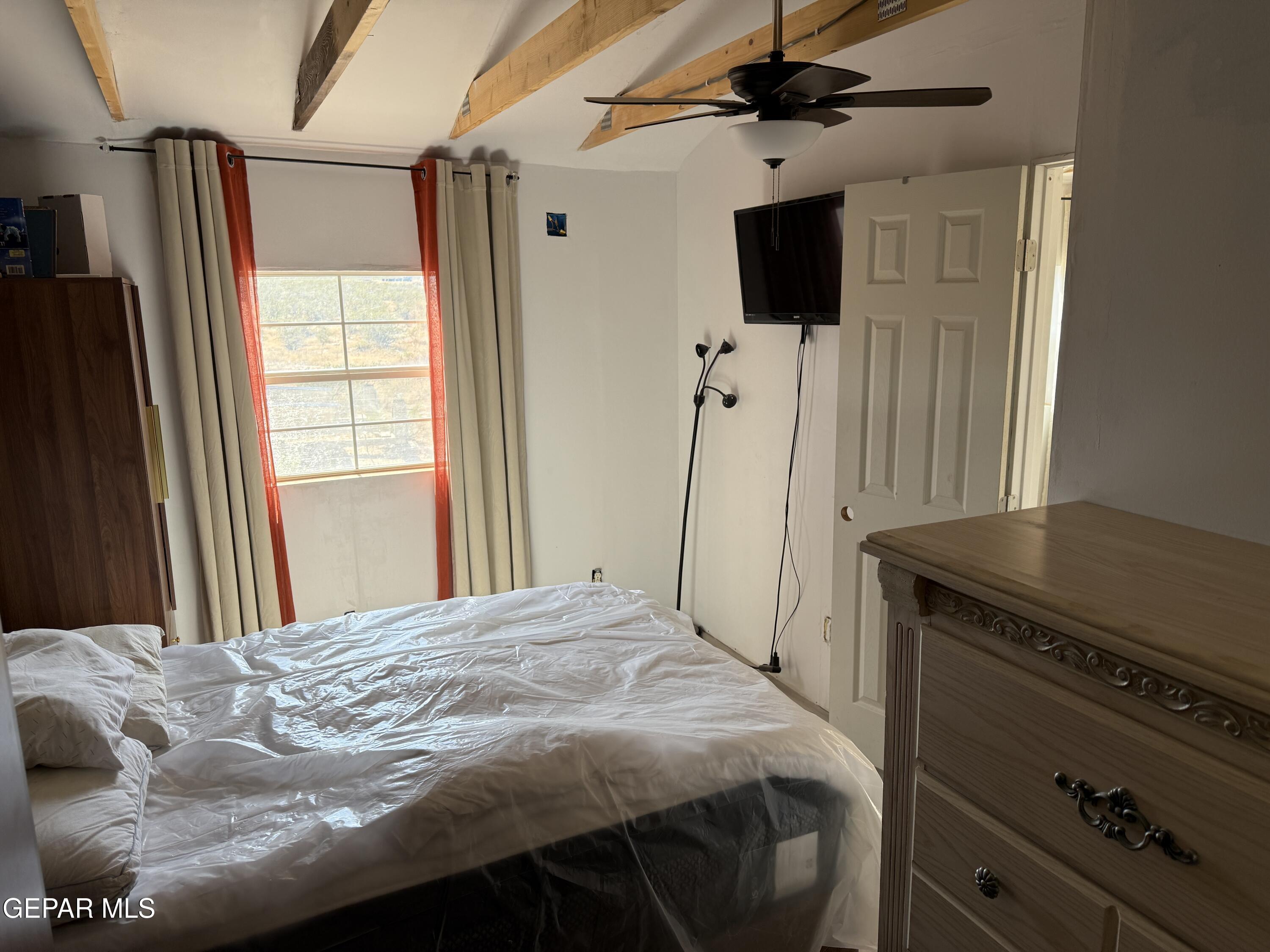 26 Ponderosa Road Salt Flat, TX 79847 - Photo 22 of 56 a bedroom with a bed and a flat tv screen