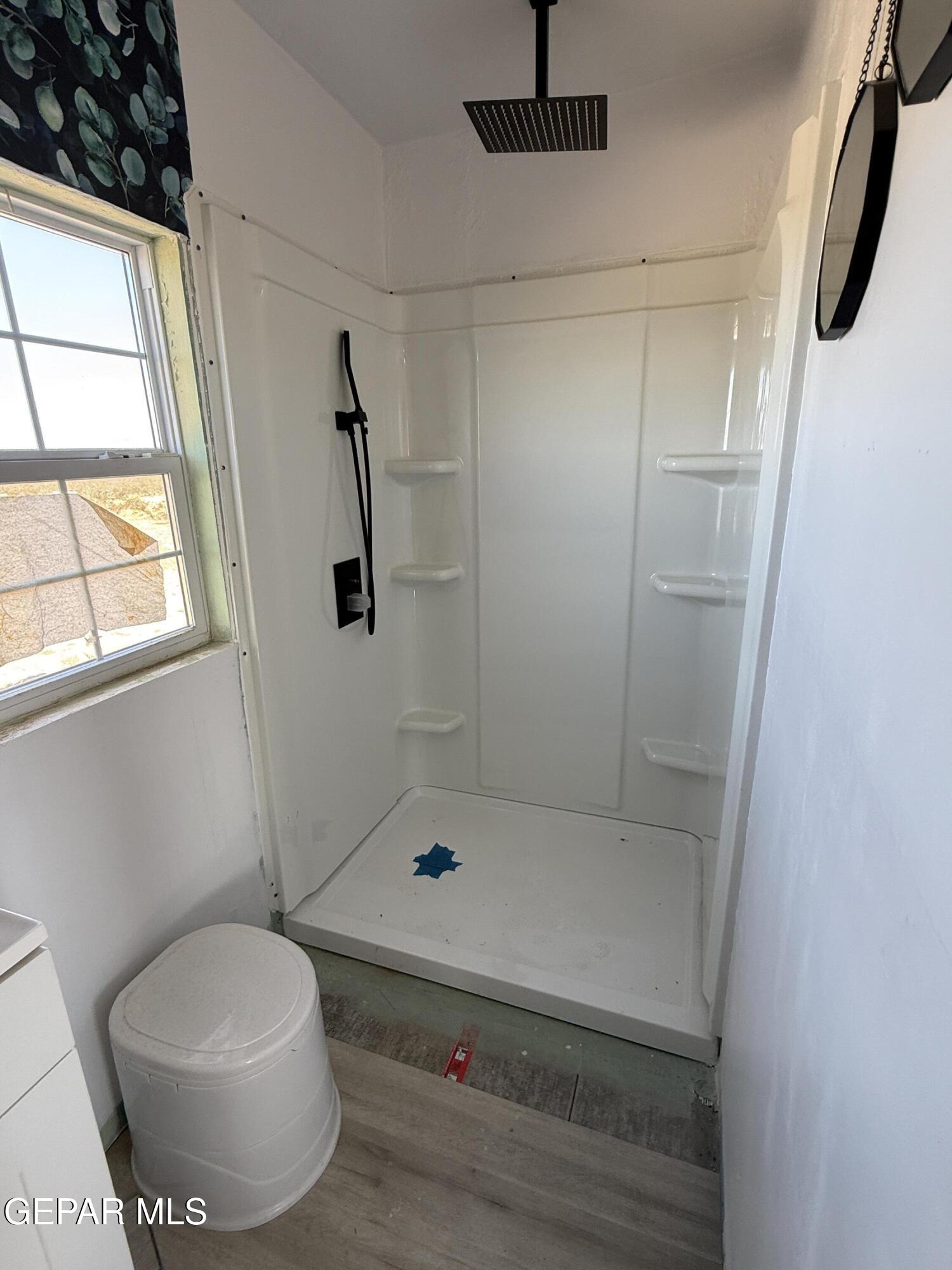 26 Ponderosa Road Salt Flat, TX 79847 - Photo 23 of 56 a bathroom with a shower and a toilet