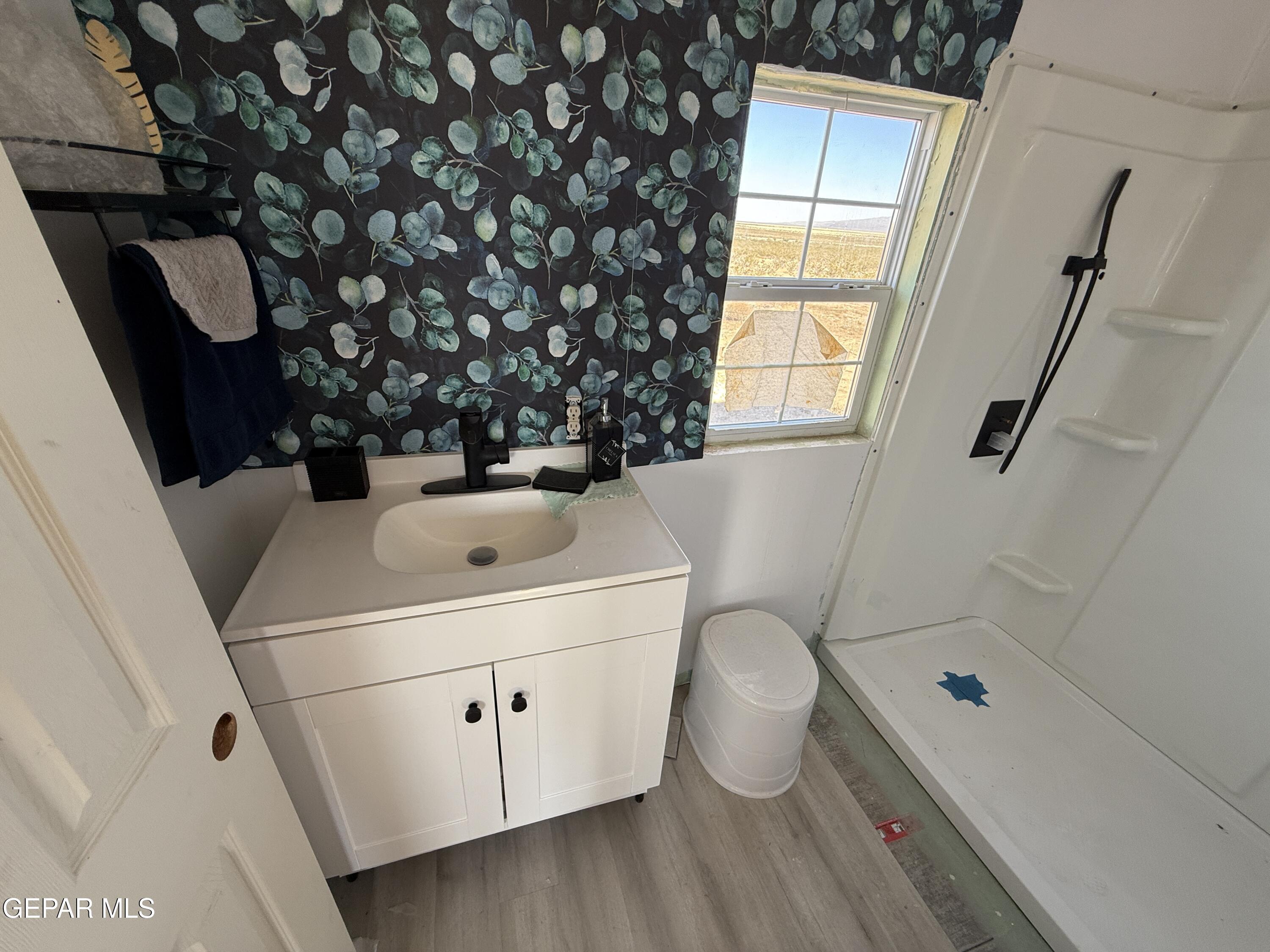 26 Ponderosa Road Salt Flat, TX 79847 - Photo 24 of 56 a bathroom with a sink toilet and shower