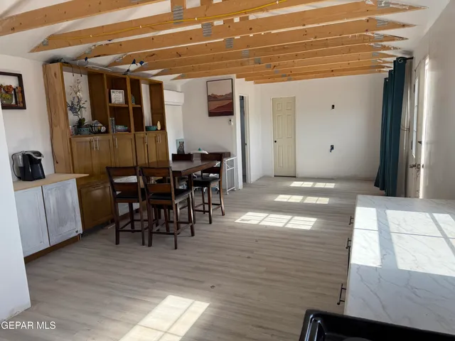 a kitchen with a stove and a refrigerator