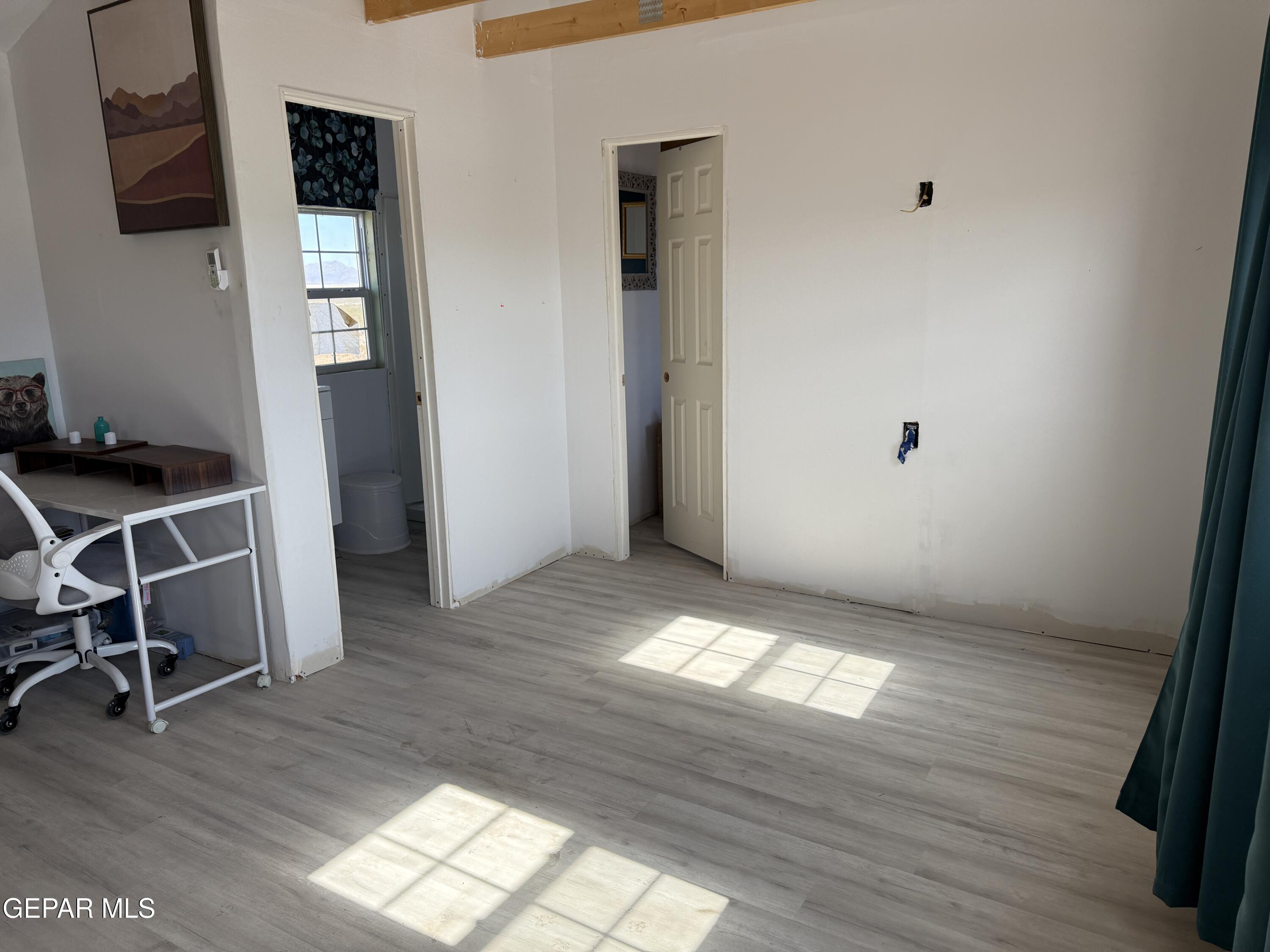 26 Ponderosa Road Salt Flat, TX 79847 - Photo 30 of 56 a view of room with window and wooden floor