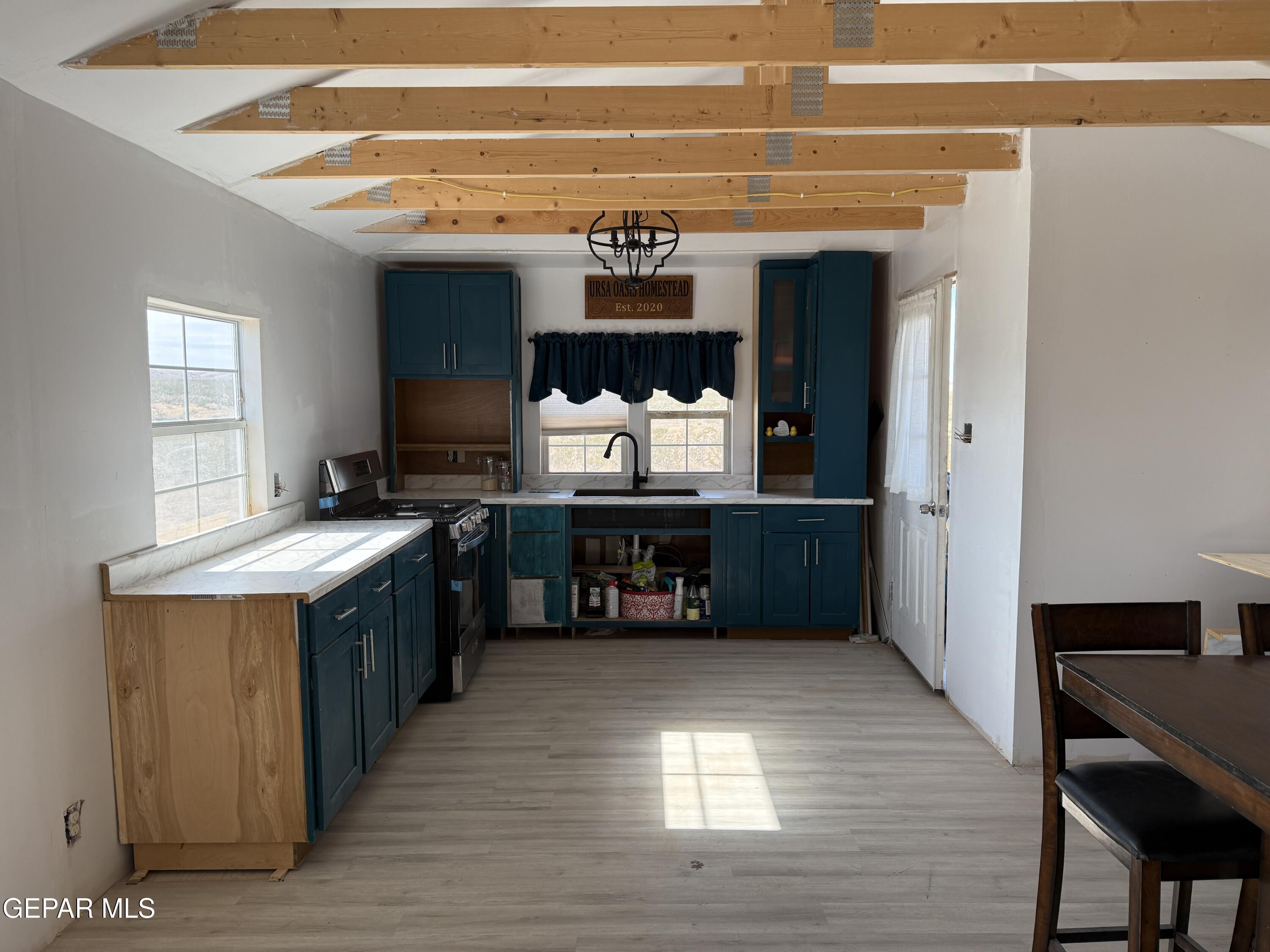 26 Ponderosa Road Salt Flat, TX 79847 - Photo 32 of 56 a kitchen with a stove and a refrigerator