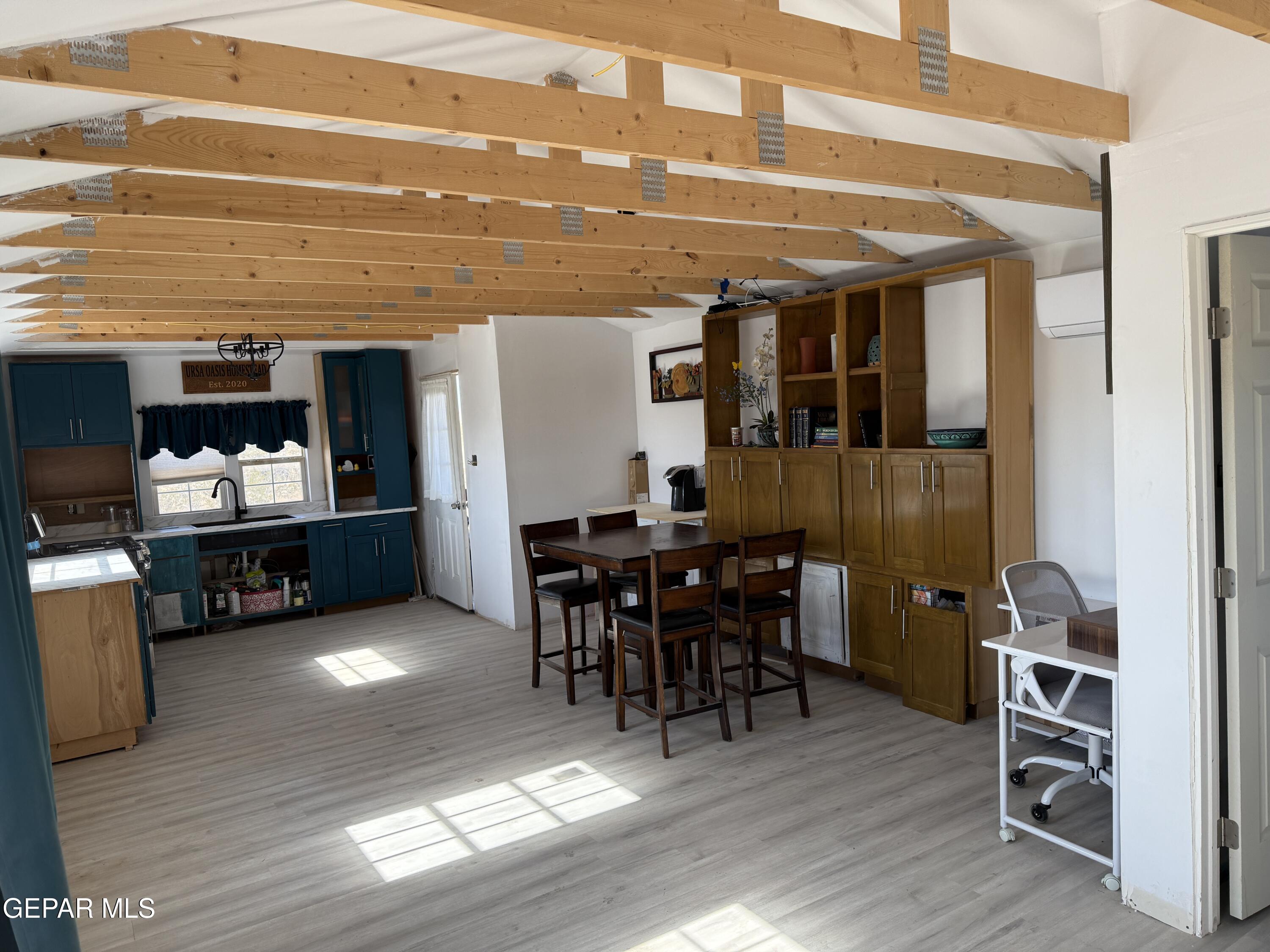 26 Ponderosa Road Salt Flat, TX 79847 - Photo 4 of 56 a view of a dining room with furniture and wooden floor