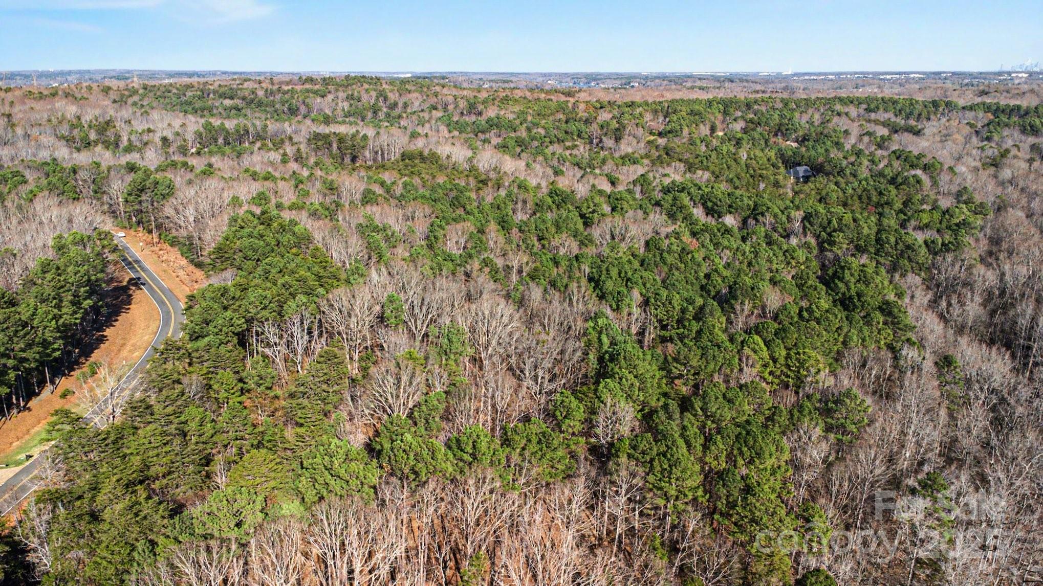 9026 Island Point Road Charlotte, NC 28278 - Photo 5 of 19 an aerial view of residential houses with outdoor space and trees