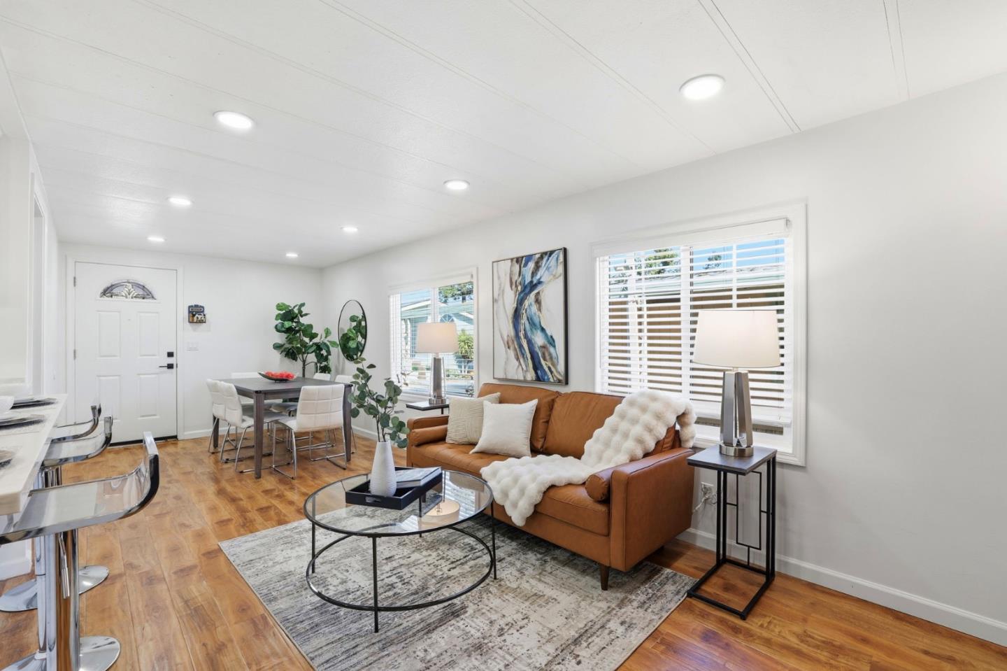555 Umbarger Road, Unit 31 San Jose, CA 95111 - Photo 2 of 18 a living room with furniture and wooden floor