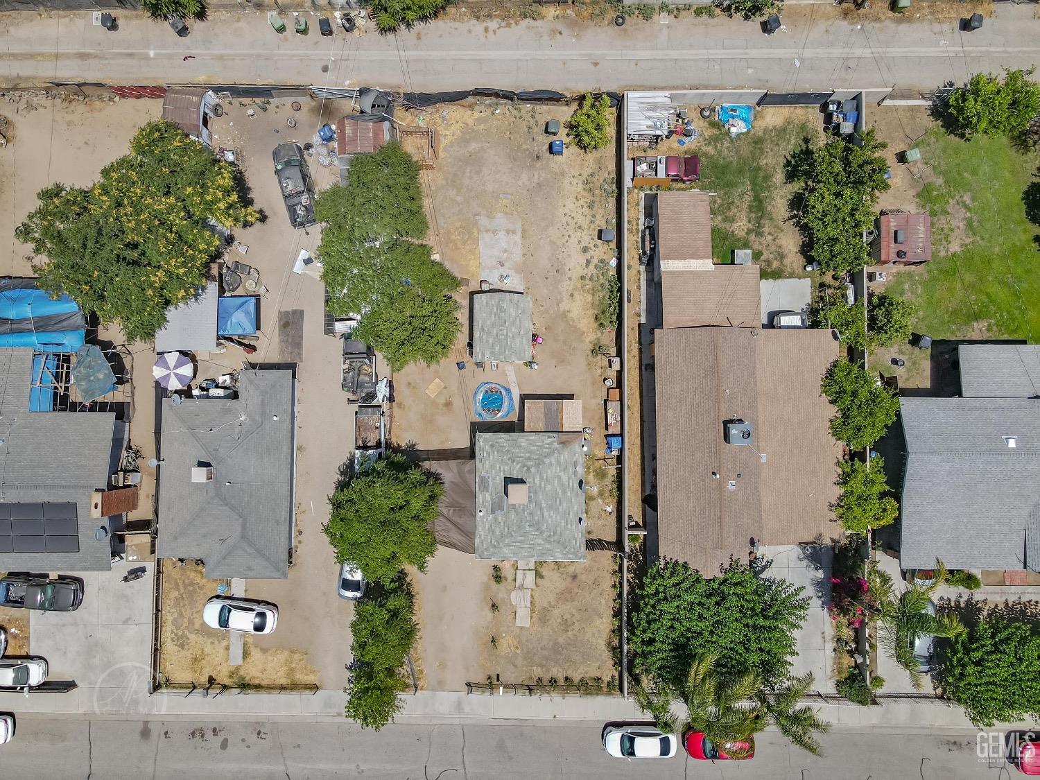 Undisclosed Address Wasco, CA 93280 - Photo 2 of 2 an aerial view of residential houses with outdoor space and street view