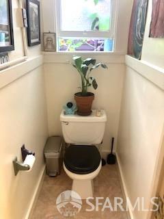 425-429 Steiner Street San Francisco, CA 94117 - Photo 37 of 40 a bathroom with a toilet sink and mirror