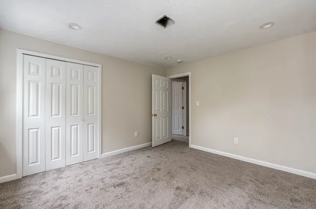 a view of balcony with wooden floor