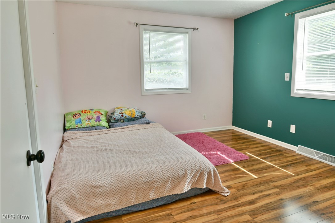 2847 Selkirk Bush Road Warren, OH 44481 - Photo 22 of 47 Bedroom featuring wood finished floors and baseboards